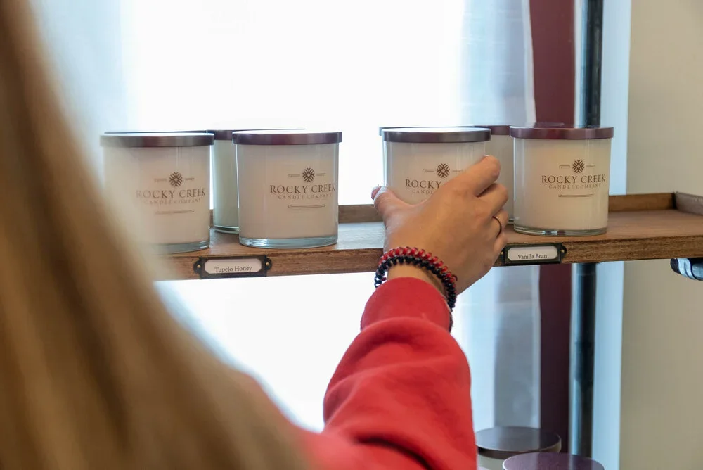 woman picking her scented candle