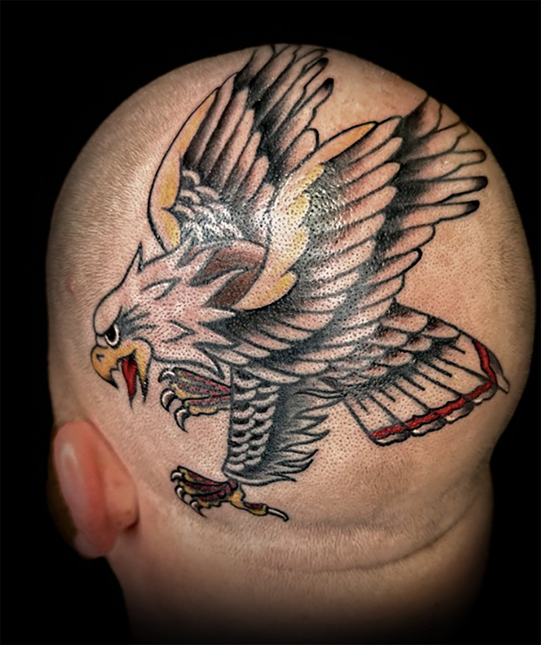 a man with a bird eagle tattoo on his arm Stock Photo - Alamy