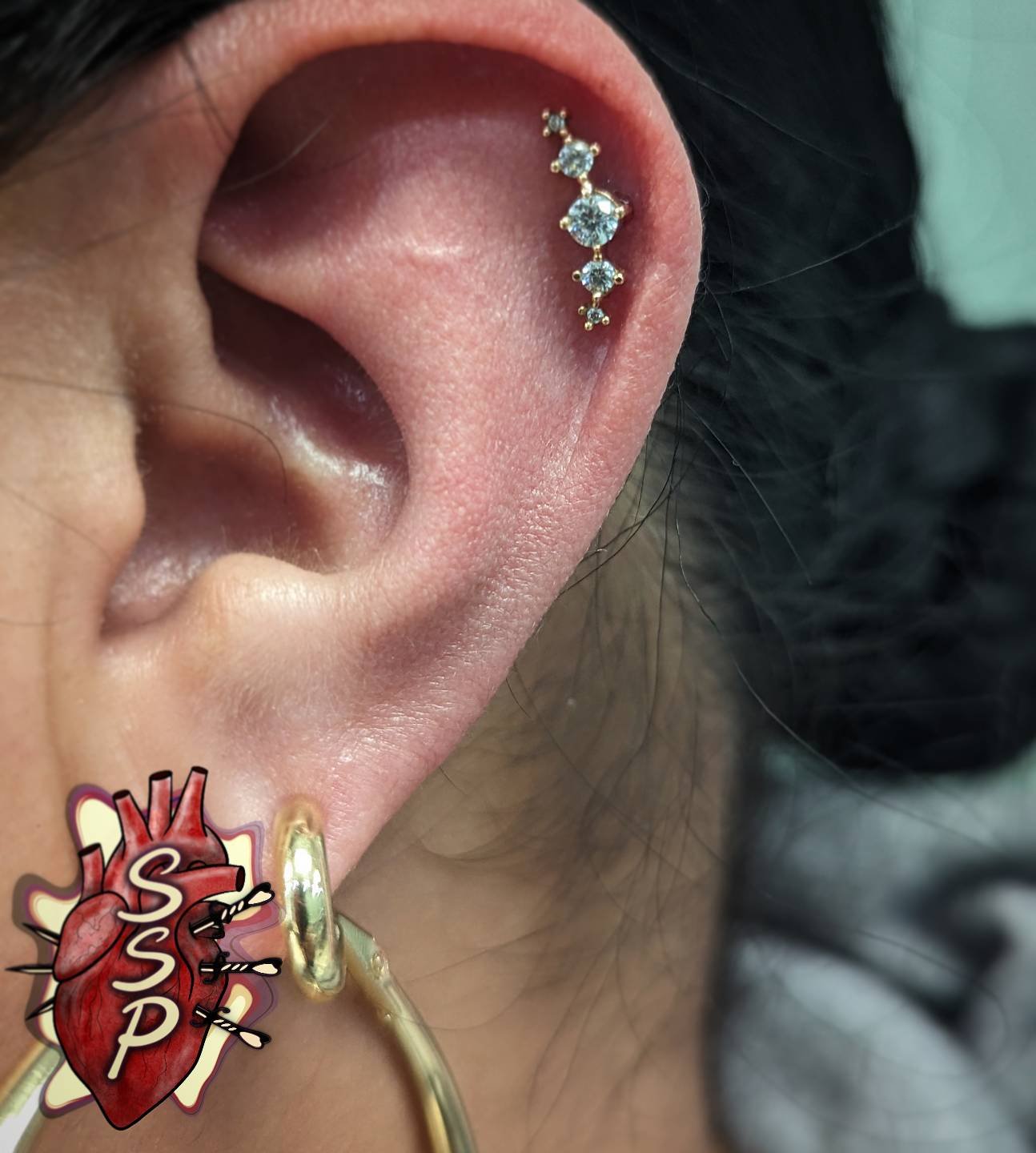 Helix piercing with a perfectly placed 14k gold cluster

If you're interested in coming in for a piercing. There is no appointment needed, you can just come into the shop while we are open. Any questions about piercings you can always give the shop a