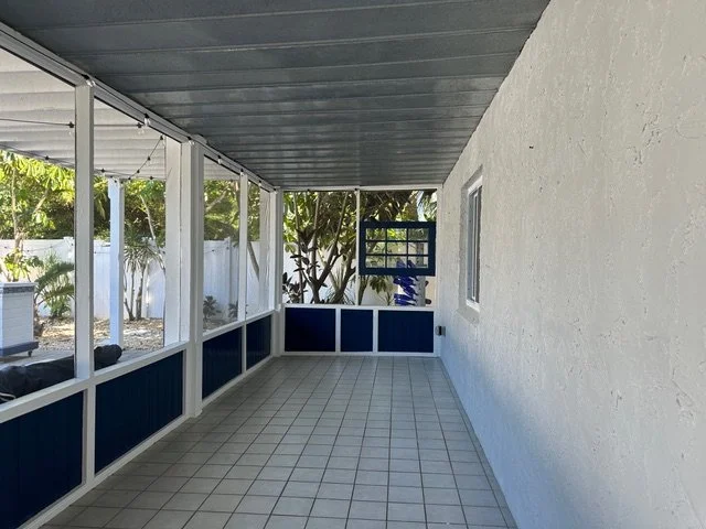 The screened porch existed but lacked the comfort and polish needed to feel like a true extension of the living space.