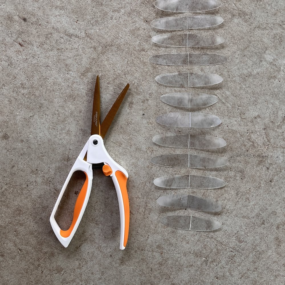 scissors with cut waste plastic.JPG