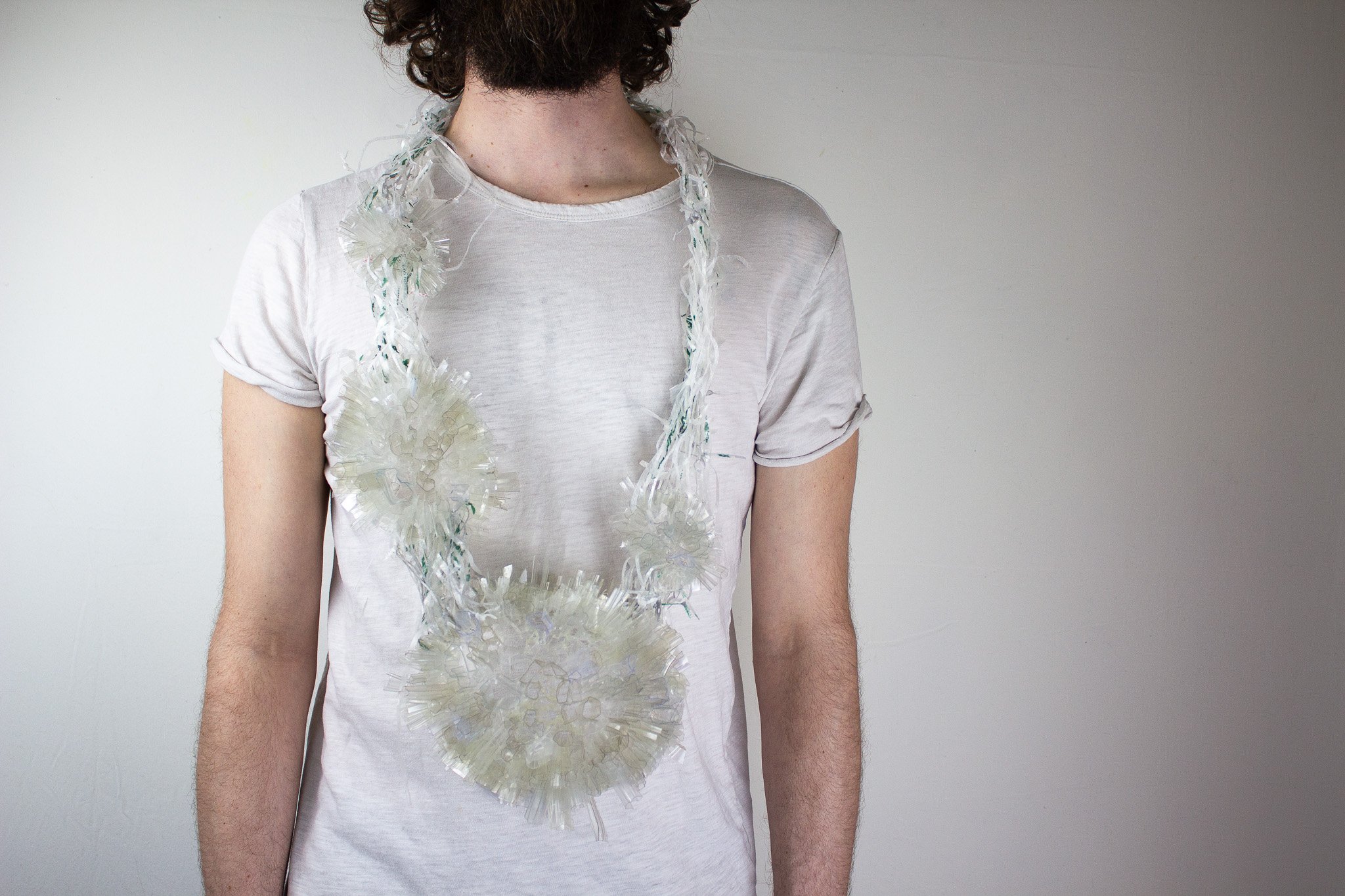 a necklace made of several forms of different sizes