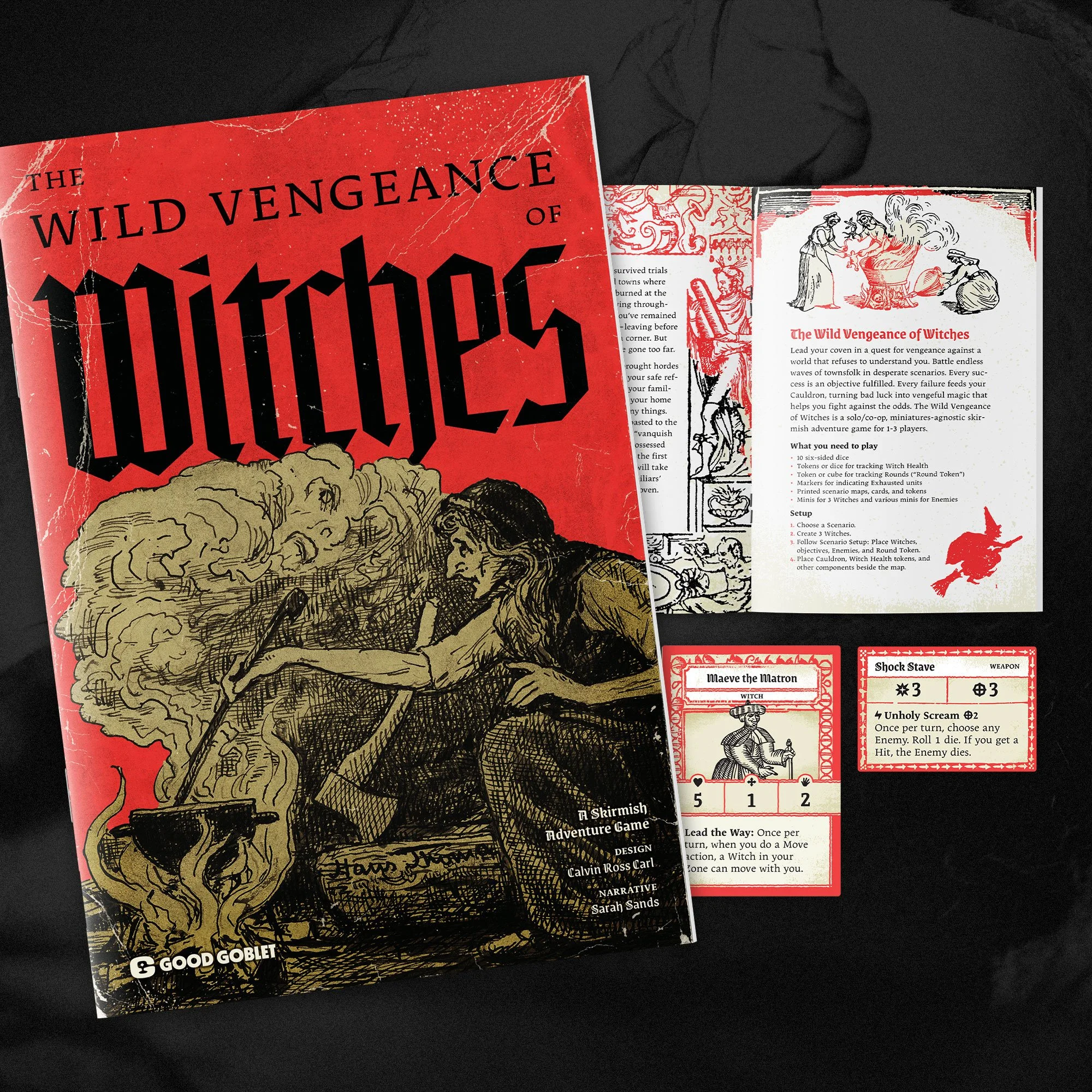 The image shows a tabletop game called 'The Wild Vengeance of Witches,' including the rulebook and character and weapon cards. The game box features an illustration of a witch stirring a cauldron surrounded by smoke.