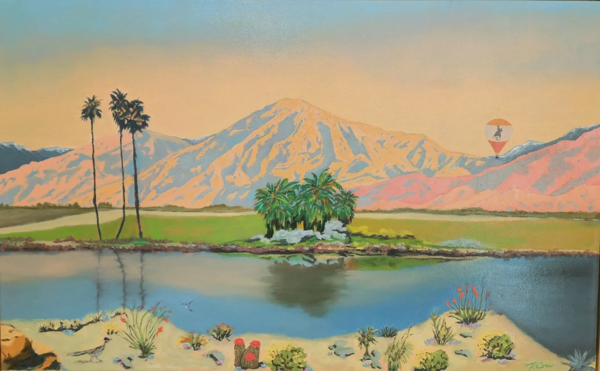 A landscape painting of a mountain with patches of snow, a hot air balloon with a cowboy silhouette, palm trees near a body of water, and desert plants in the foreground.