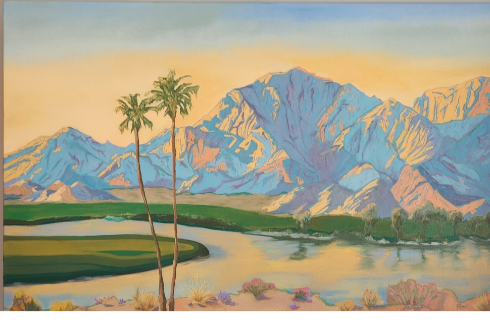 Painting of desert landscape with snow-capped mountains, two palm trees, a river, and desert plants in the foreground.