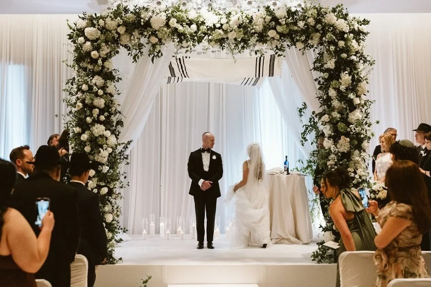 Where tradition meets effortless luxury. A white-and-green symphony of purity, lineage, and love &mdash; celebrated with poetic grace under the chuppah.

&bull; Photography: Adam Houseman | @adamhouseman
&bull; Videography: Shutter and Soun @shuttera