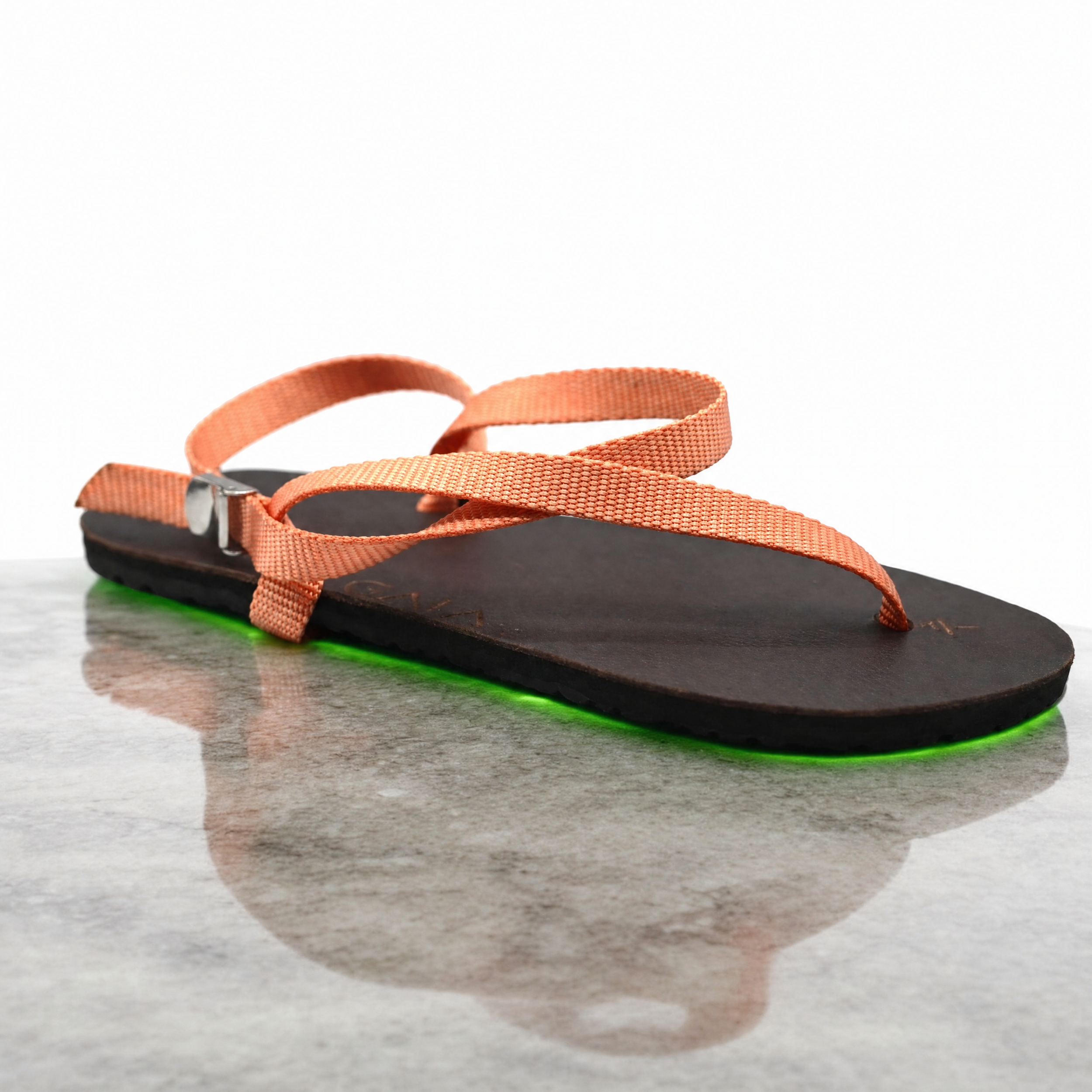 Agent%20Image%20-%20Take%20this%20exact%20sandal%20product%20photo%20and%20place%20it%20on%20a%20smooth_%20polished%20stone%20surface-4.png