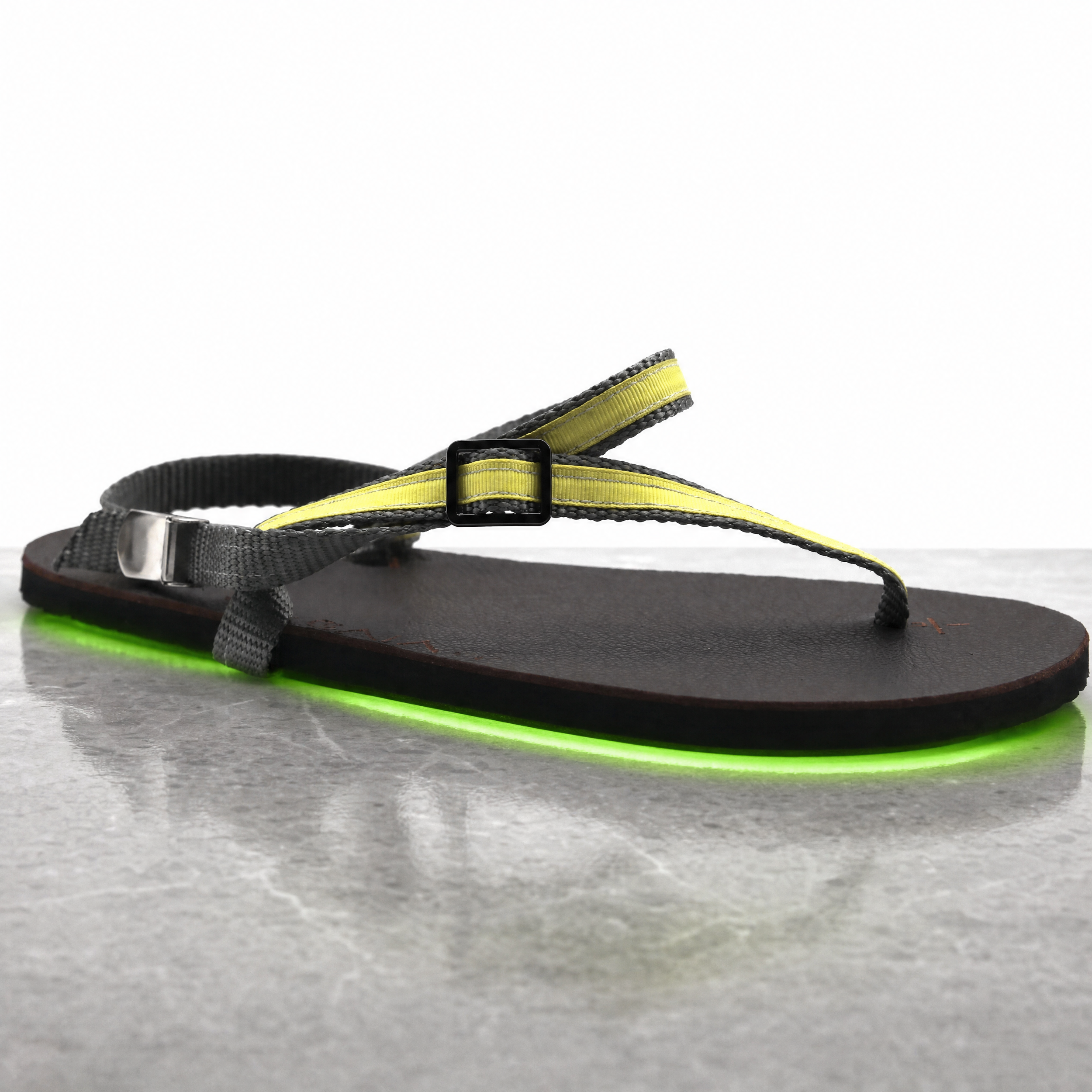 Agent%20Image%20-%20Take%20this%20exact%20sandal%20product%20photo%20and%20place%20it%20on%20a%20smooth_%20polished%20stone%20surface.png