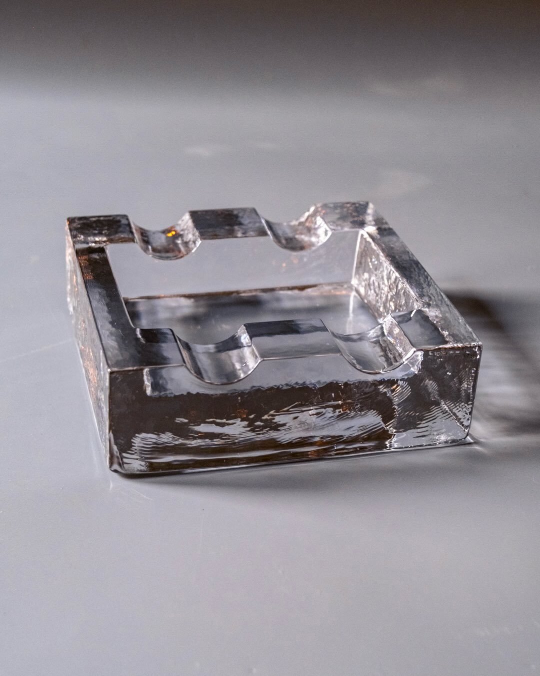 Lindshammar Ashtray by Christer Sj&ouml;gren, 1960s/70s

Do you smoke? Fabulous! We have the perfect item for your naughty little hobby &mdash; the sculptural glass ashtray designed by Christen Sj&ouml;gren for Lindshammar Glasbruk, Sweden. Chunky cl