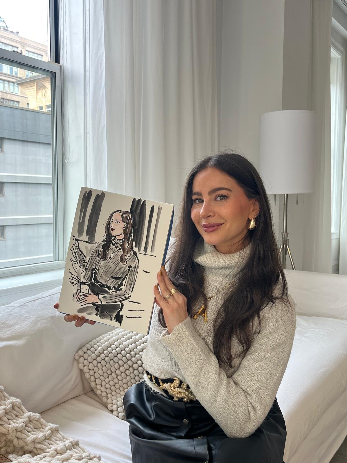 Guest holding her sketch