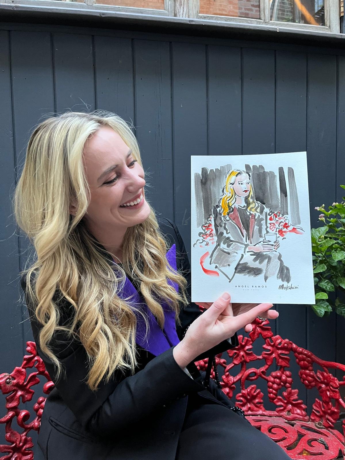Guest holding her sketch