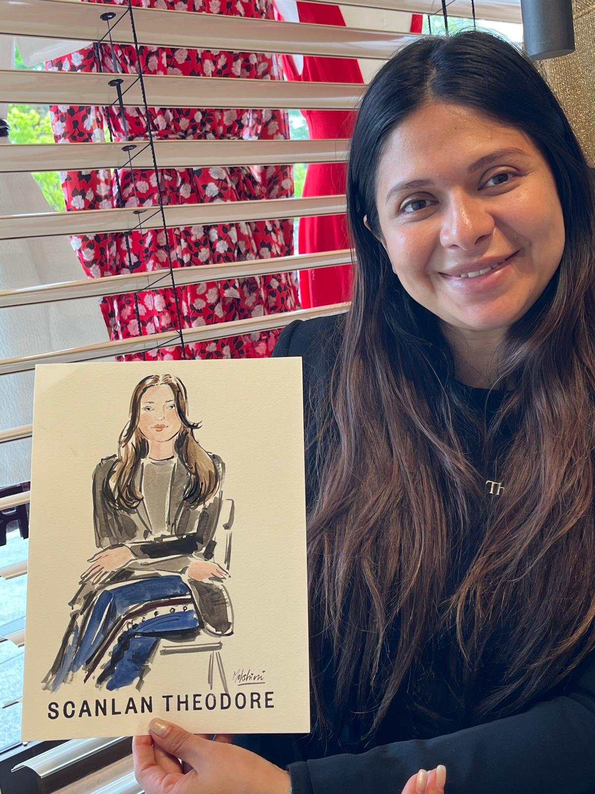 Guest holding her sketch