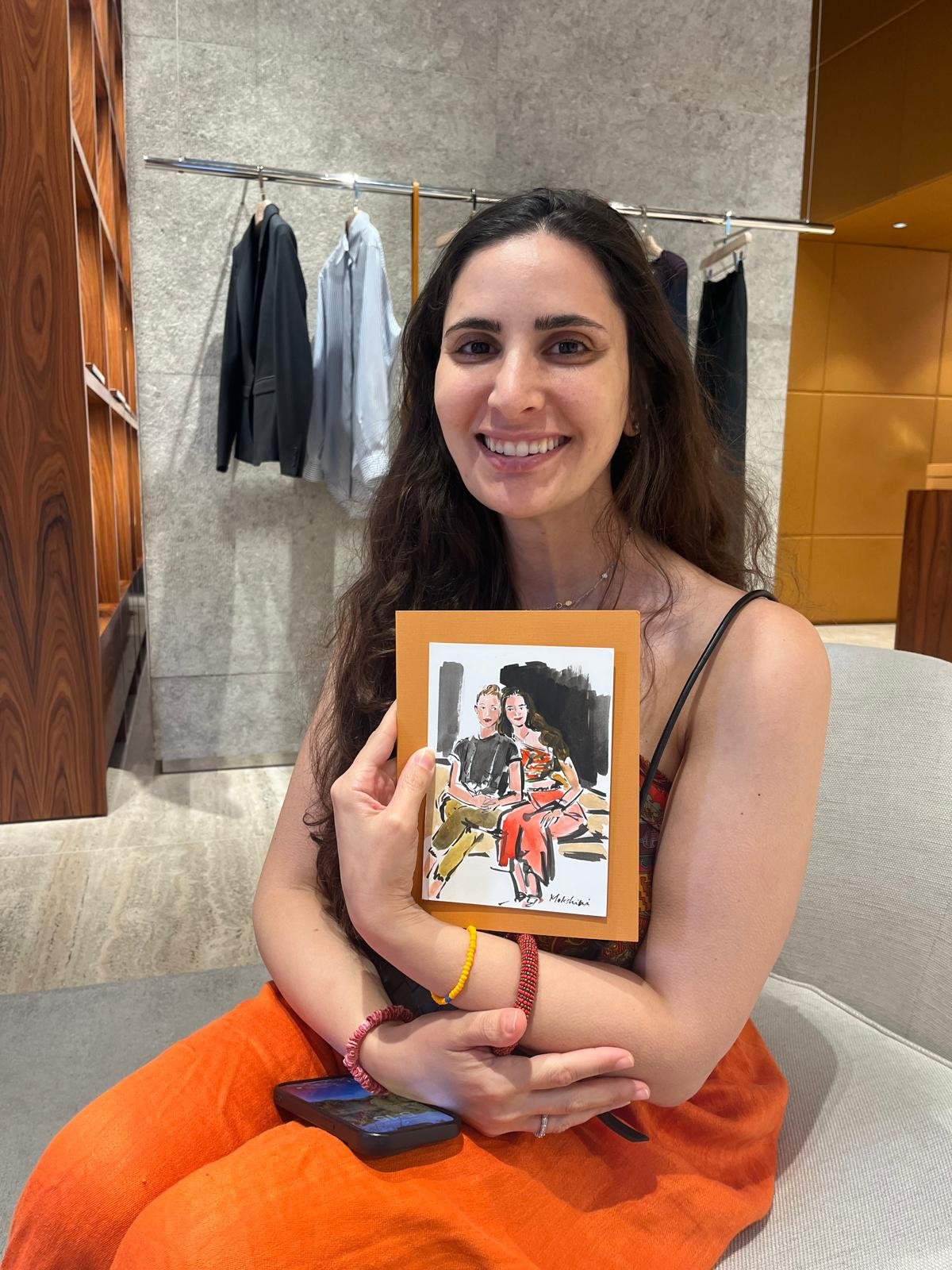 Guest holding her sketch