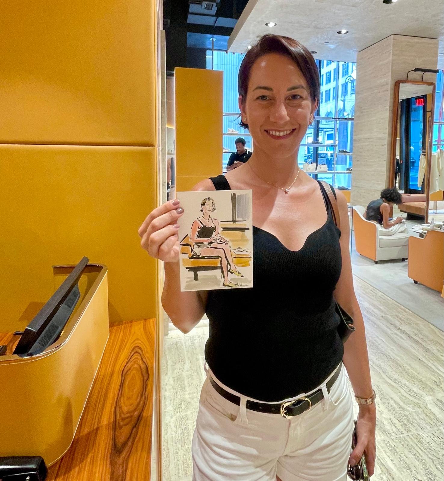 Guest holding her sketch