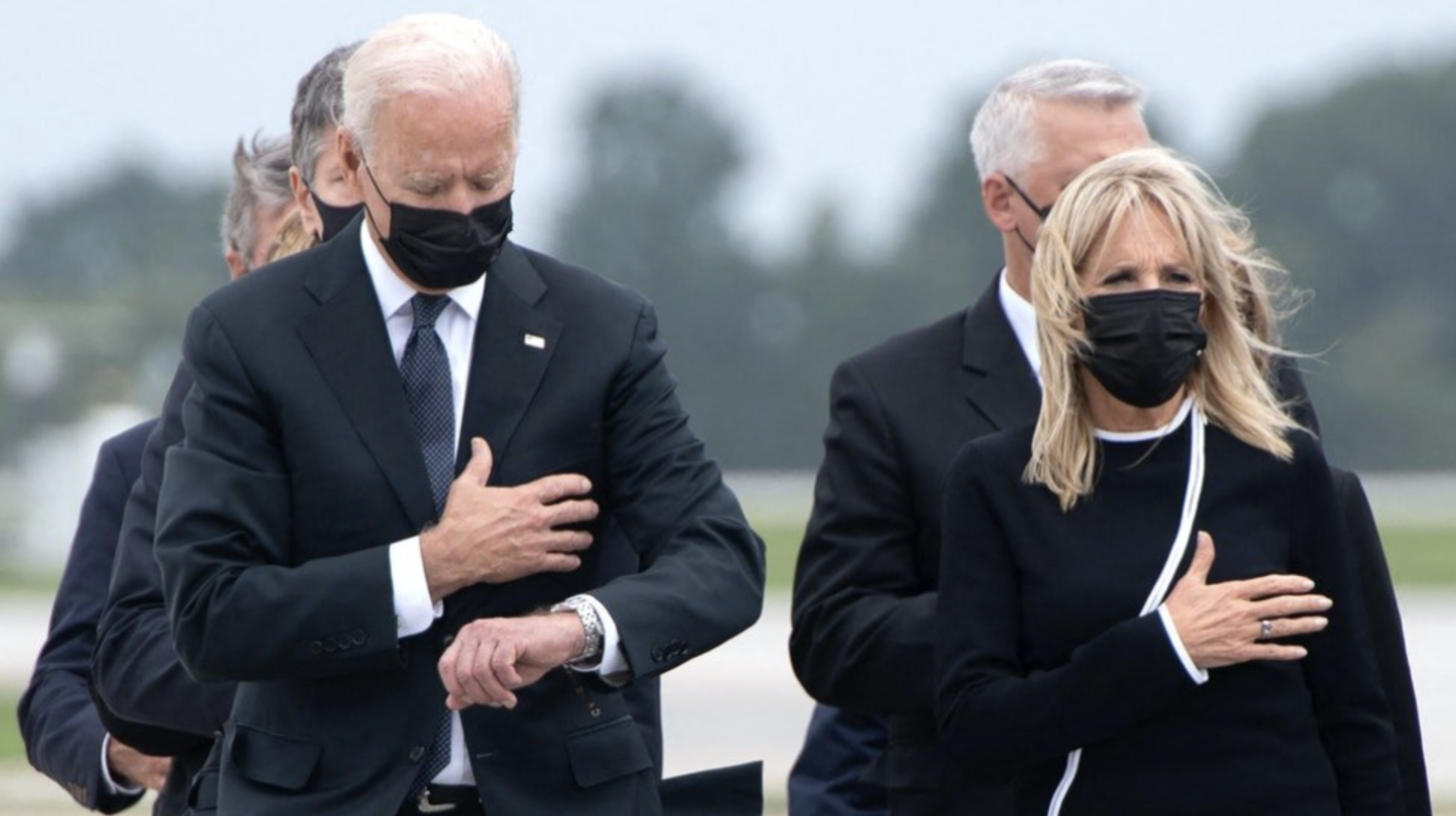 Biden appears to check time while attending transfer of 13 fallen service members