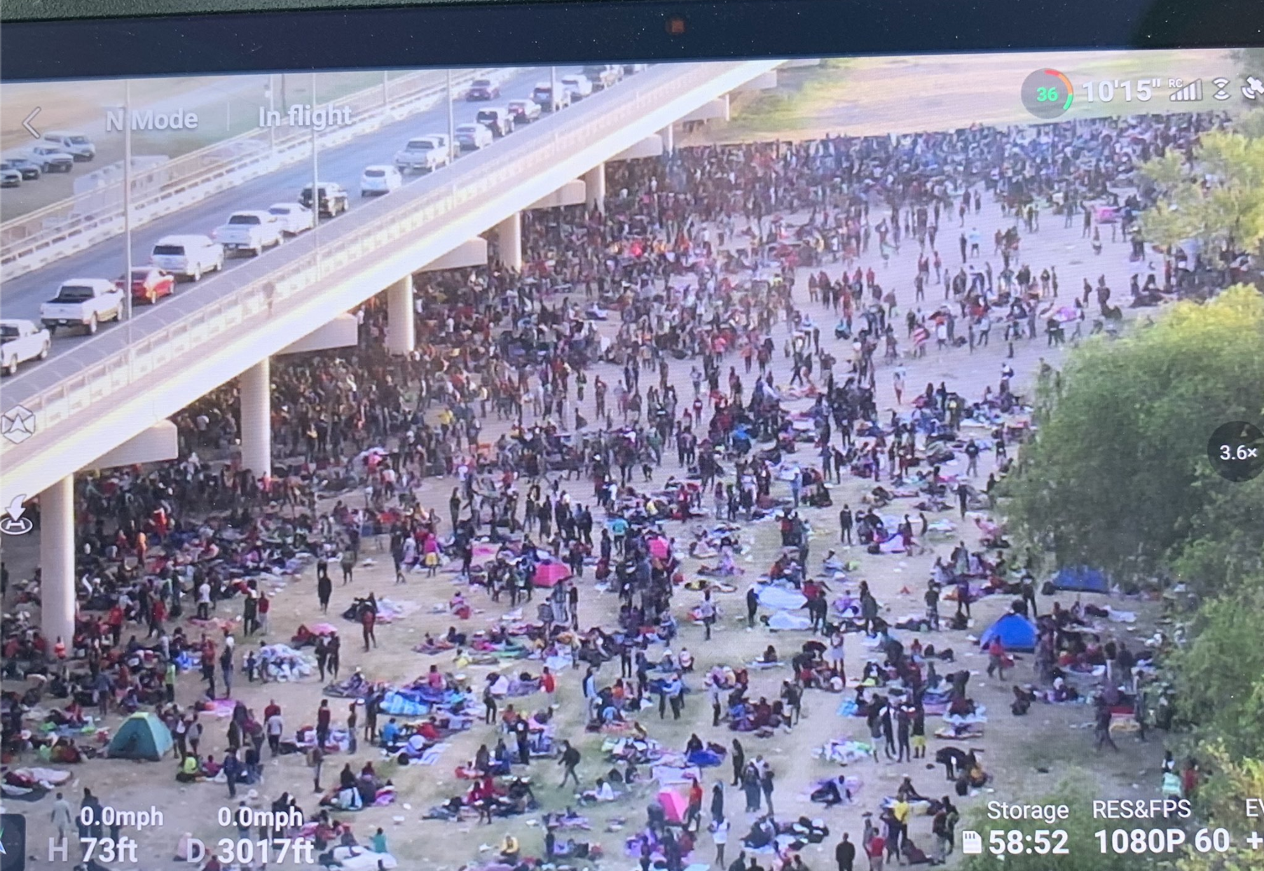 Thousands of migrants gather under bridge in Texas