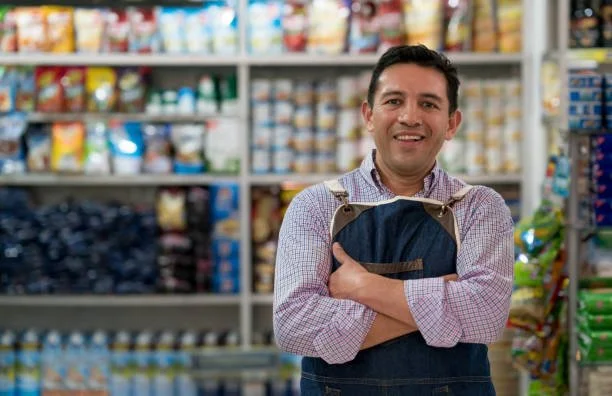 show owner smiling standing in the show isle