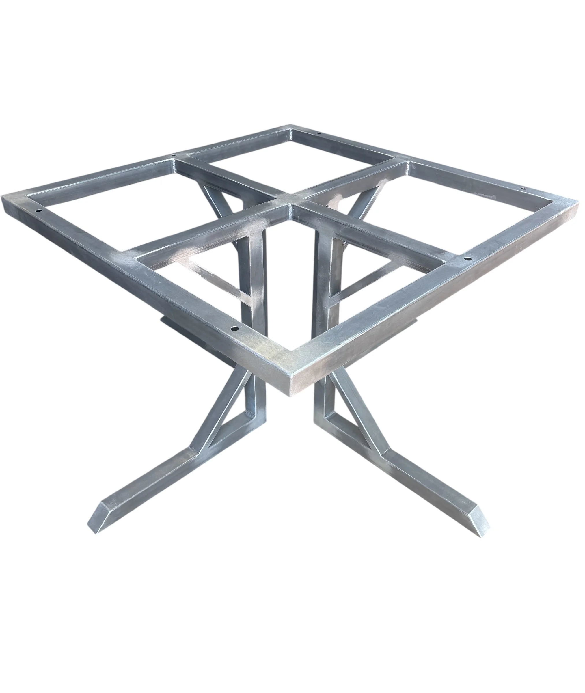 Metal framework table with square openings and angled legs.