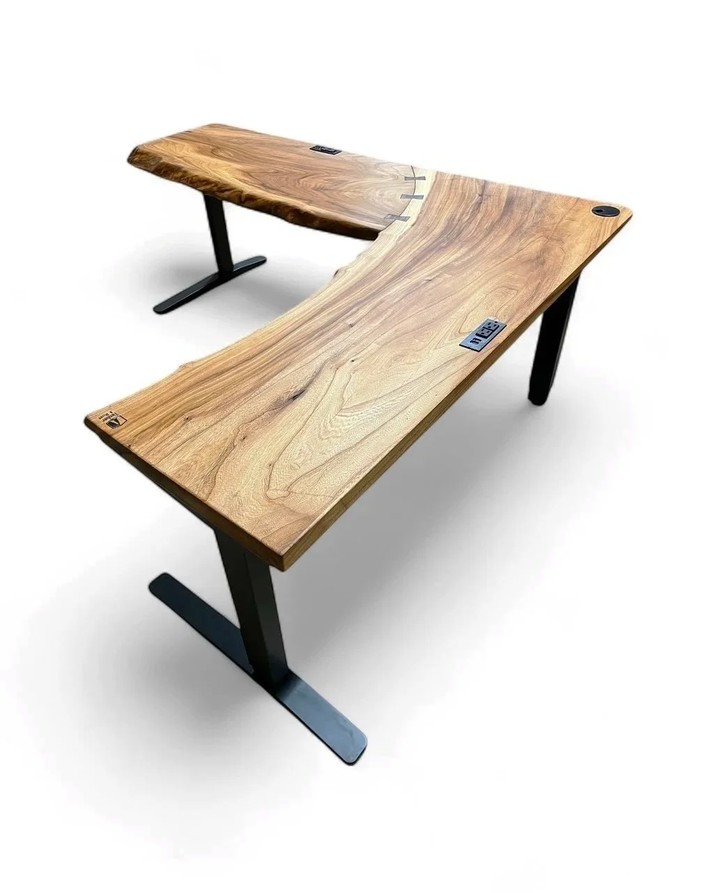 A modern wooden desk with metal legs, featuring a natural wood finish with visible grain patterns and a curved shape, set against a plain white background.