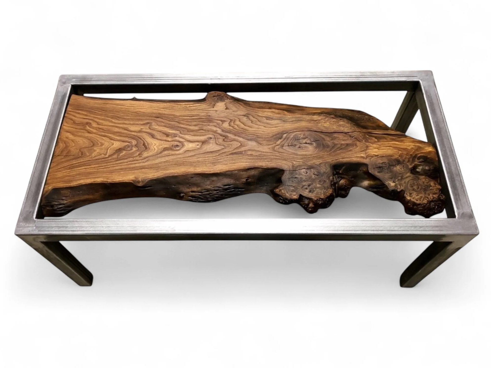 A coffee table with a thick, natural wood slab top and a silver metal frame.
