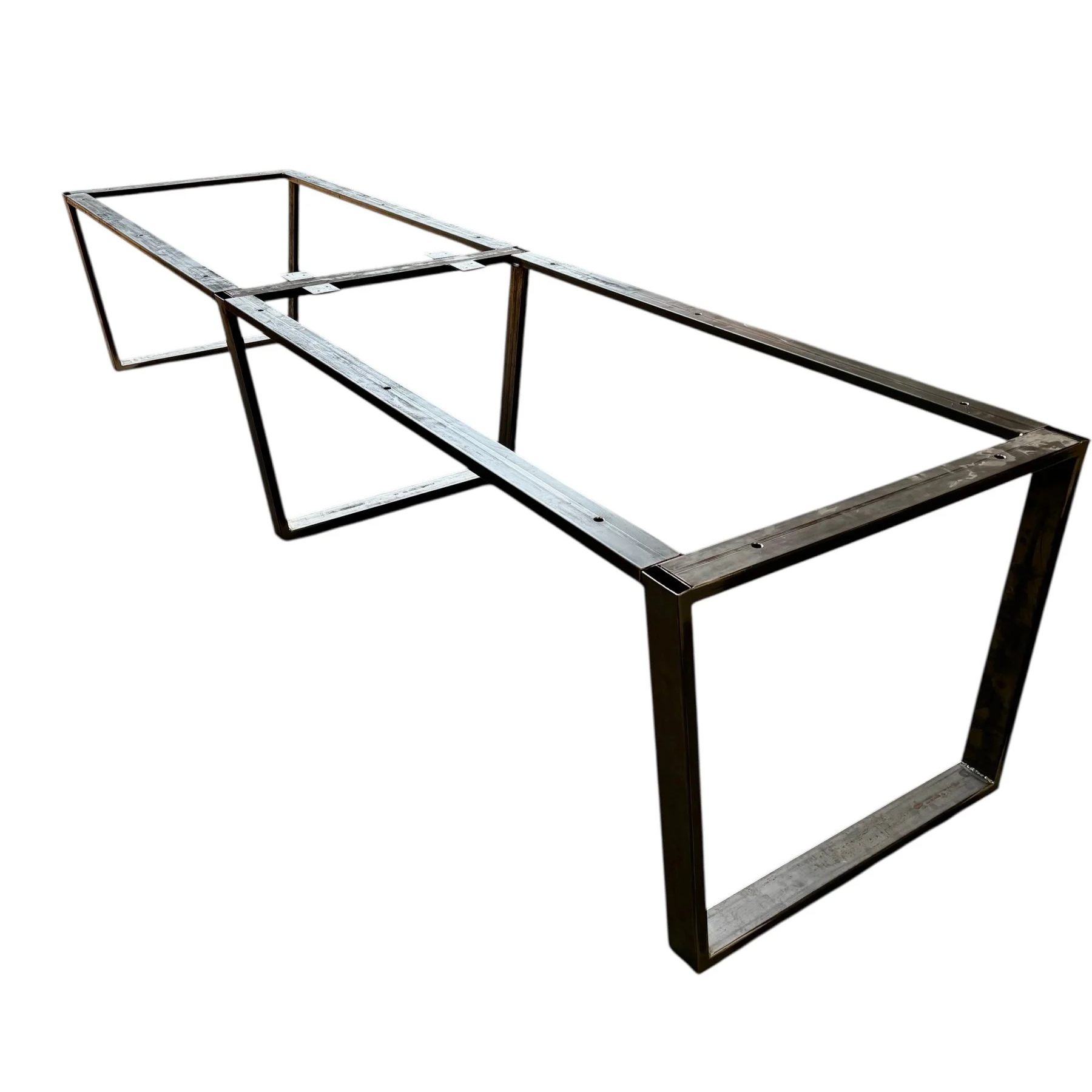 Metal table frame with rectangular and L-shaped sections, isolated on white background.