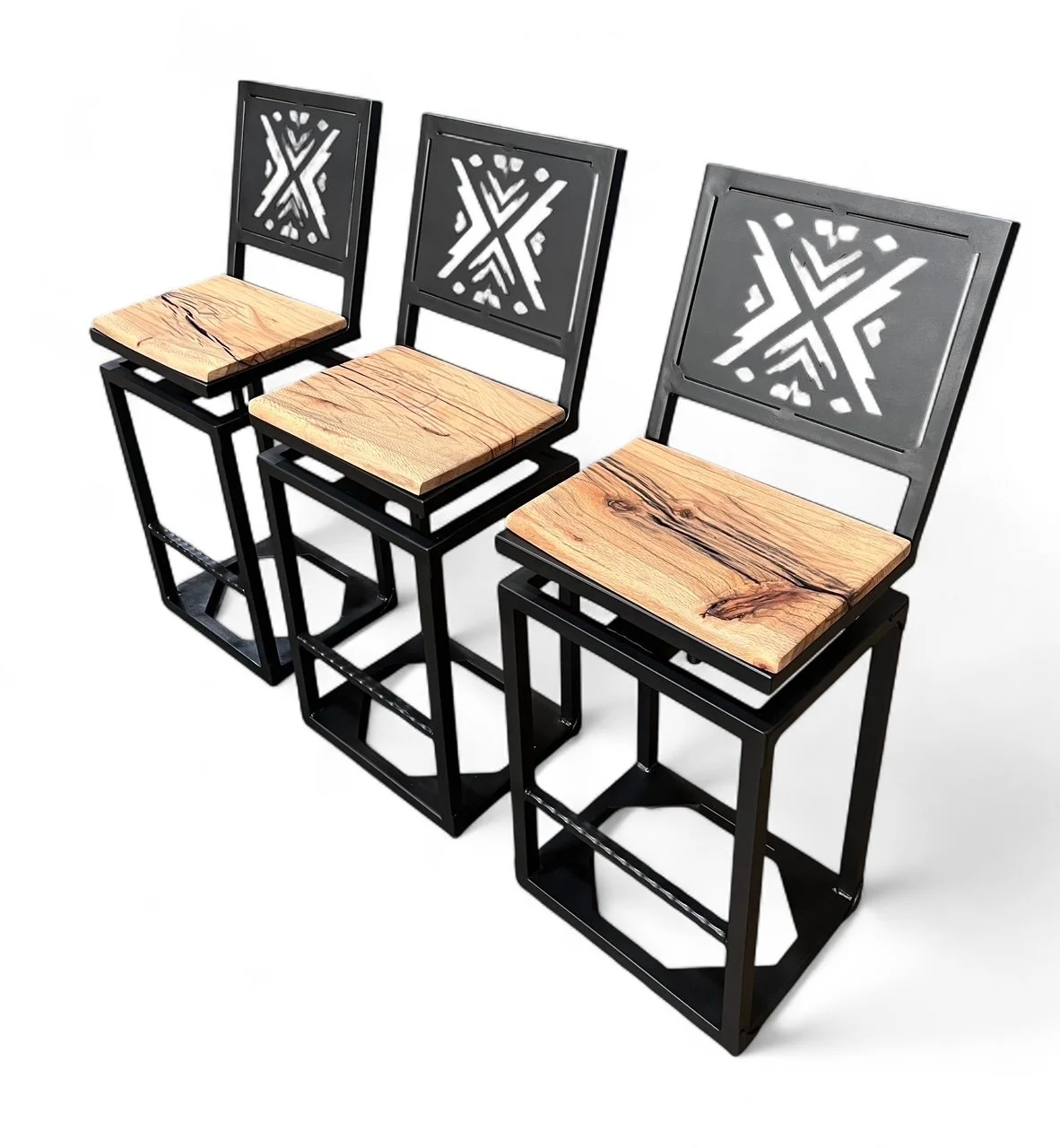 Three modern bar stools with black metal frames, wooden seats, and decorative metal backs with a geometric snowflake design, arranged in a row against a white background.