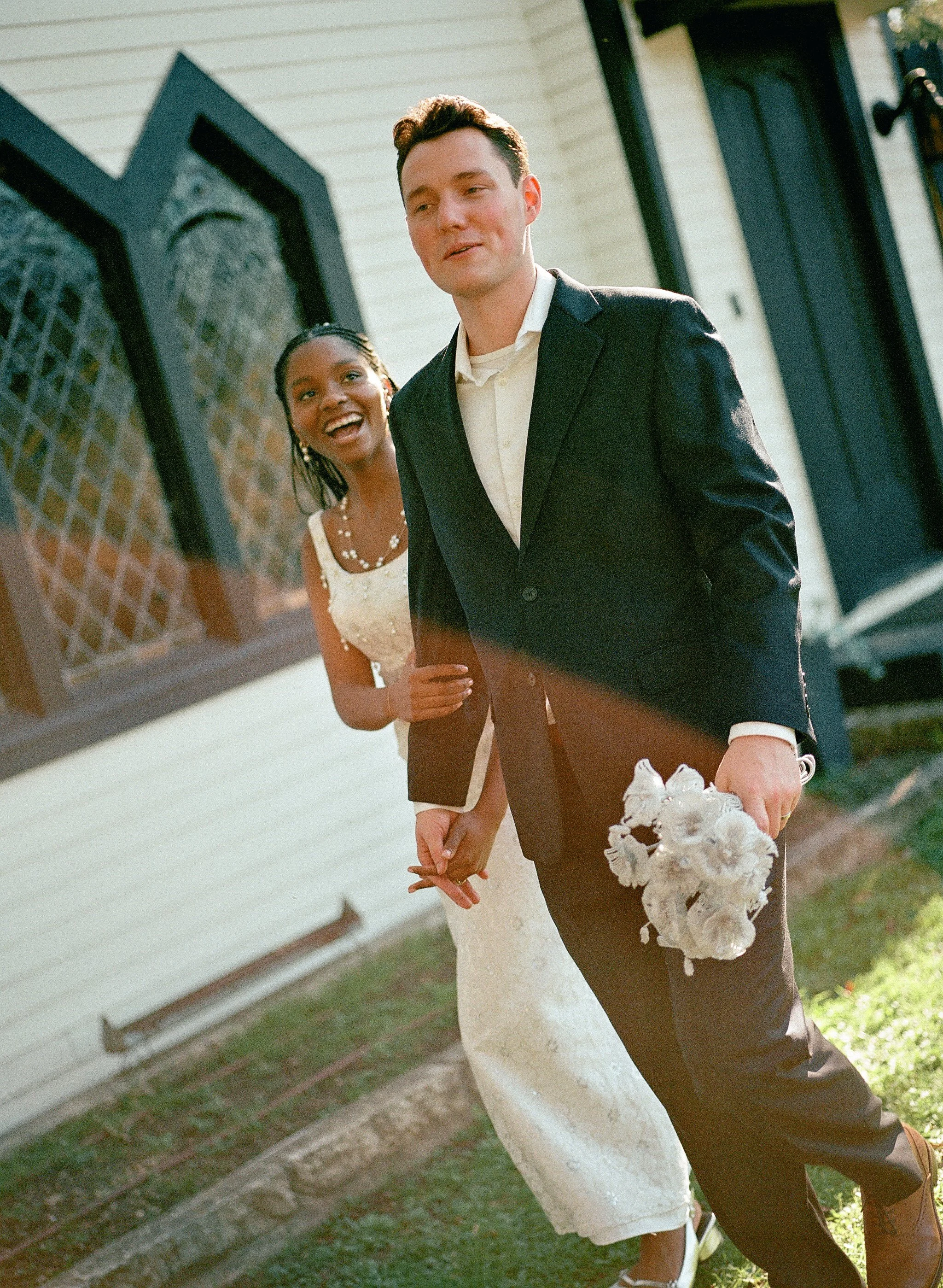 Bride and groom walking hand in hand after eloping in Texas.
