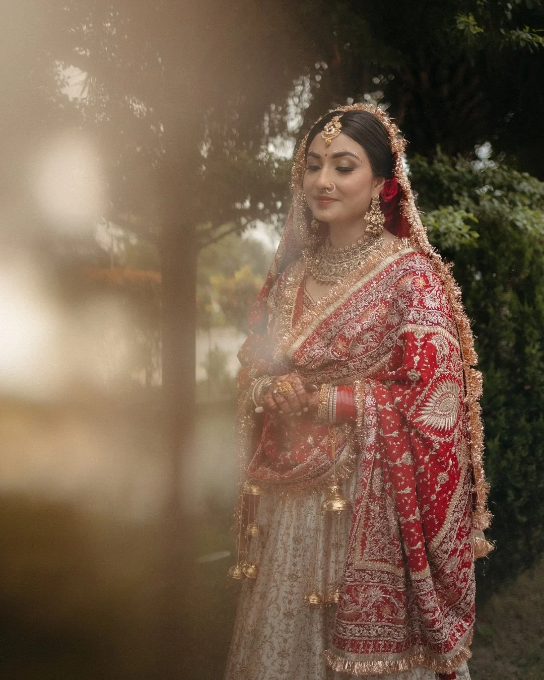 A bride who wore tradition like second skin&mdash;timeless in her Ritu Kumar, radiant in her quiet confidence.

Manyata brings an effortless kind of grace&mdash;the kind that doesn&rsquo;t shout, just stays.
In her heirloom reds and timeless jewels, 