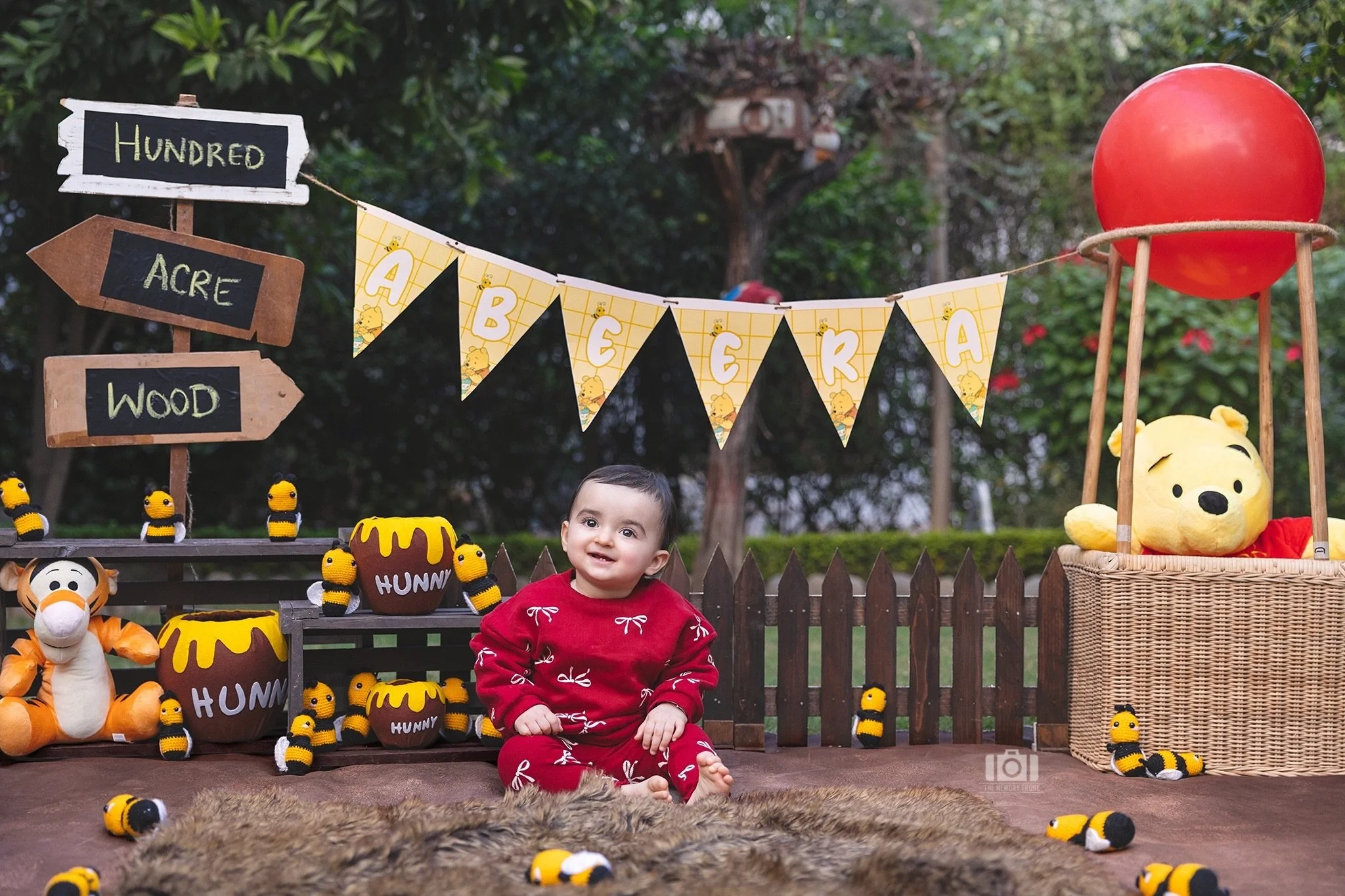 A little bit of Hundred Acre Wood magic, wrapped in the tiniest giggles and the biggest cuddles. 🧸❤️ 

#TheMemoryTrunk #BabyPhotoshoot #FirstBirthdayShoot #WinnieThePoohTheme #OutdoorBabyShoot 

[first birthday photography, Winnie the Pooh birthday 