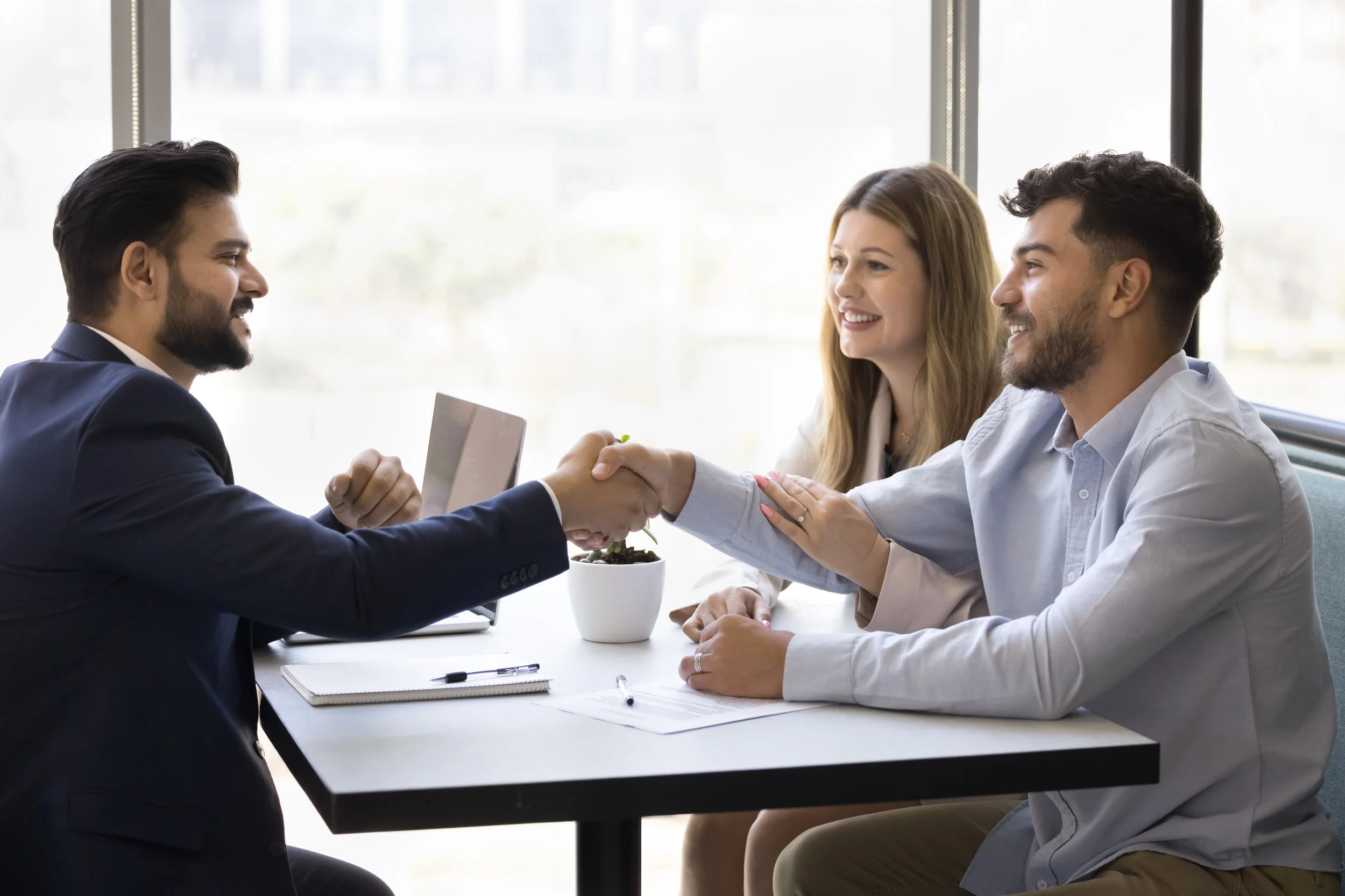 Real Estate investors meeting with a dual-licensed realtor and property manager from Power Properties
