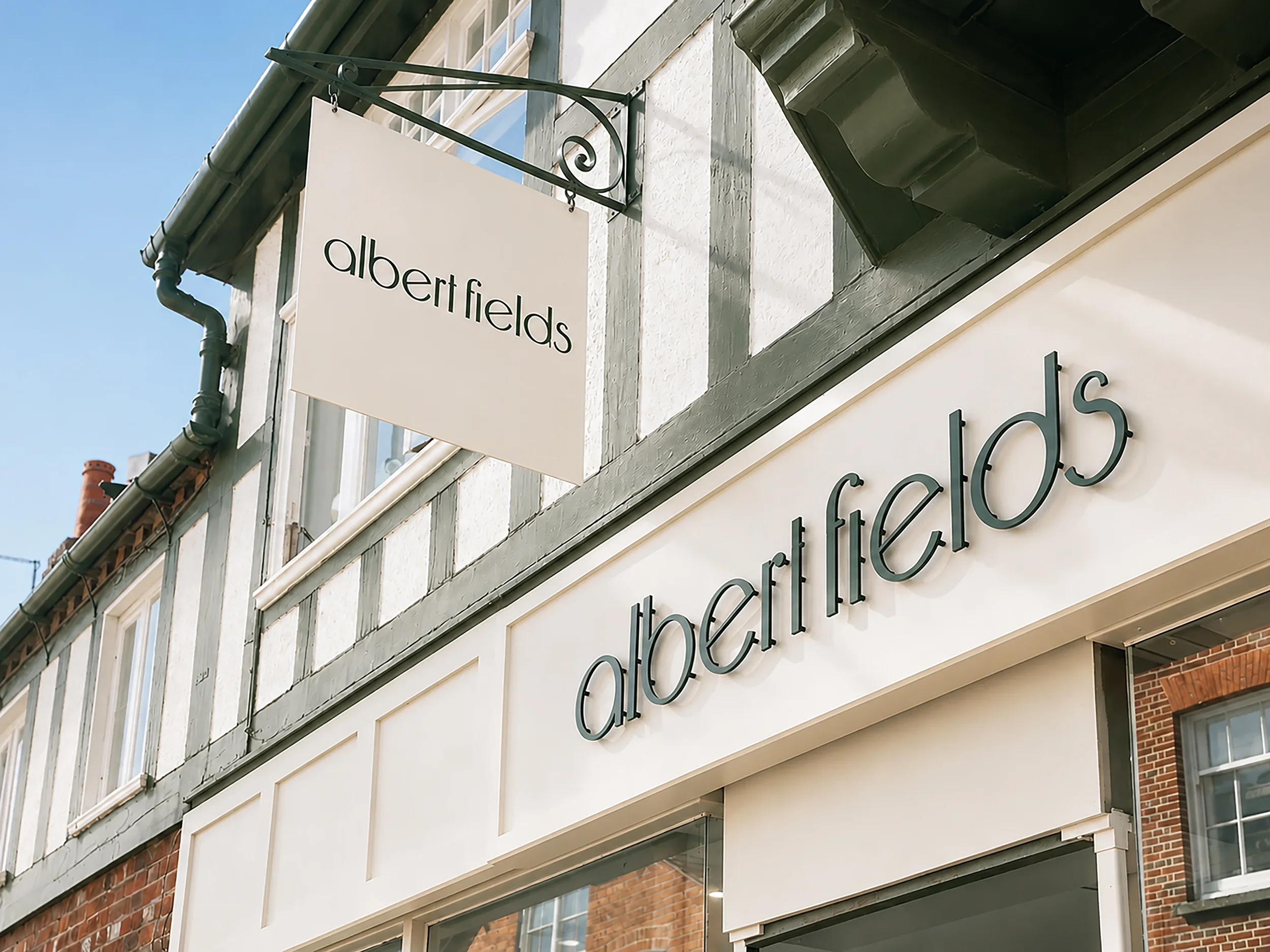 Albert Fields hair salon exterior in Goring-on-Thames, showing the branded shopfront and hanging signage.