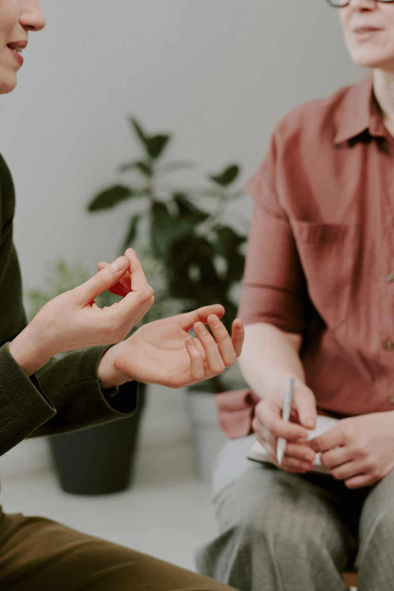 A Youch Coach working with a client in a therapy session