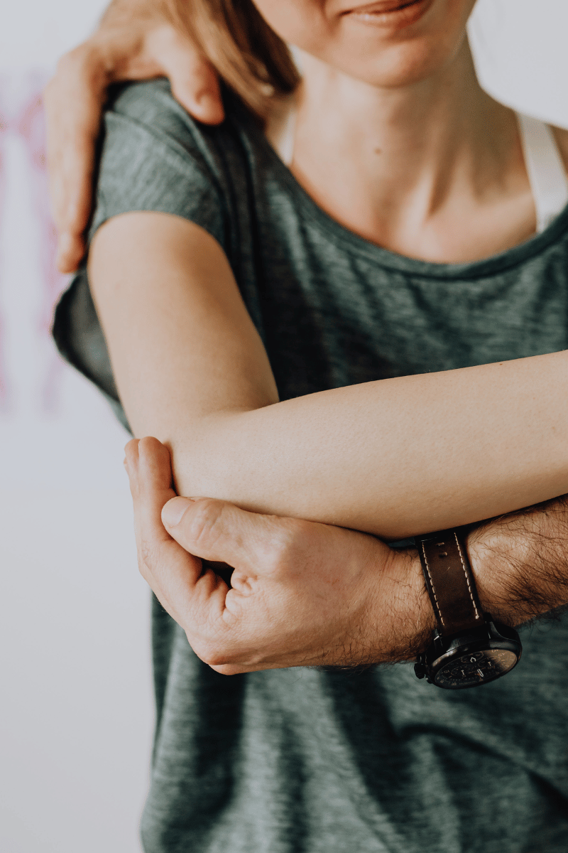 A Chiropractor helping a patient with adjustment
