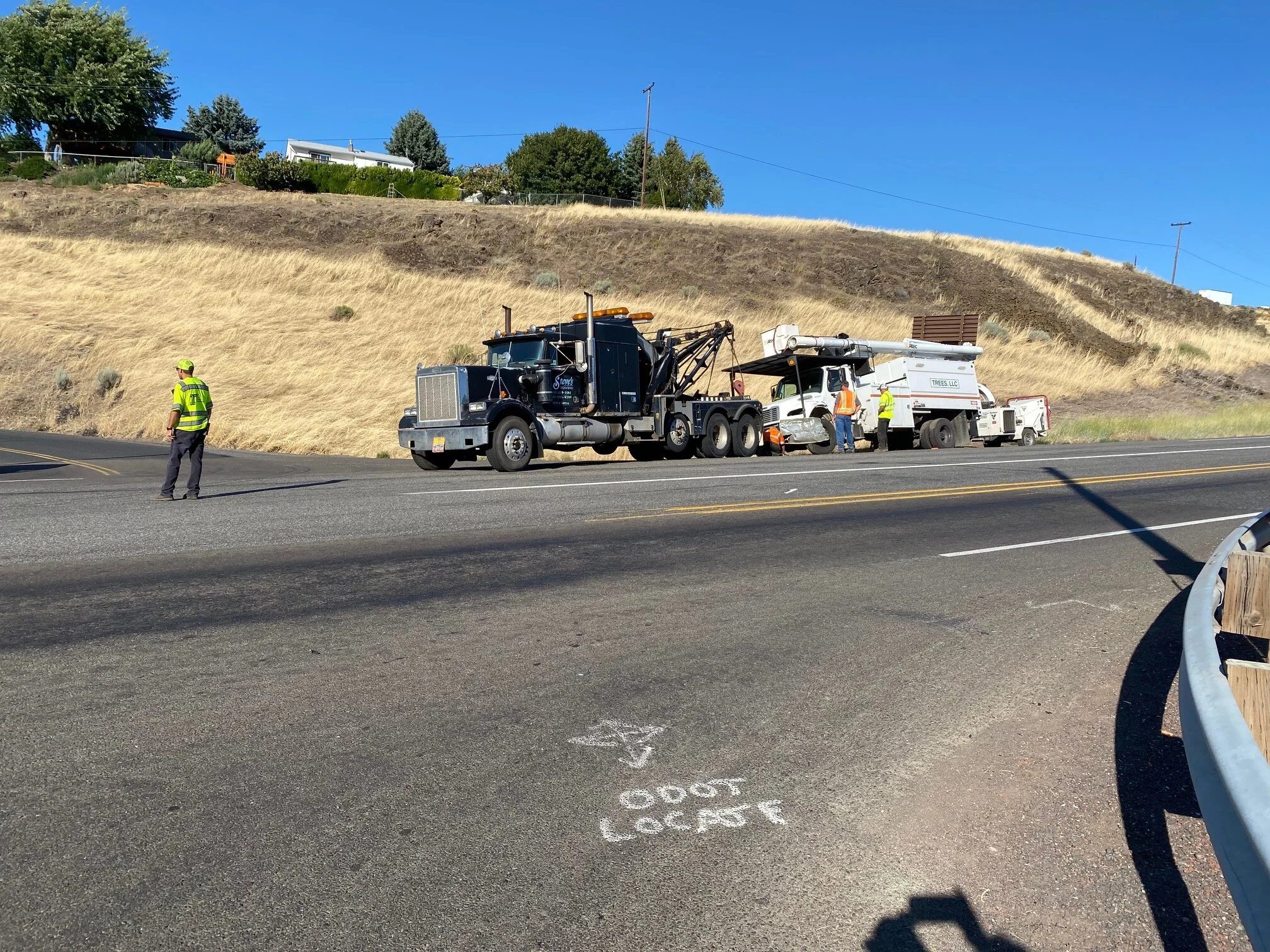 Tow truck drivers hook up to an Oregon Department of Transportation Trees Inc. vehicle after three vehicles collided at Freemont and Highway 197 on July 8th. Neighbors contend that a high-density subdivision will add traffic to “this already dangero…