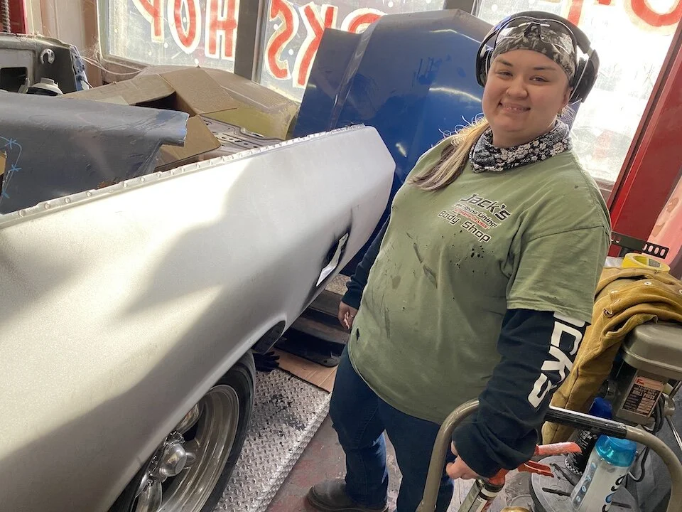 Stefanie Wilkinson shows off some of her handy work. She had recently welded this quarter panel into a 1972 Chevrolet El Camino.