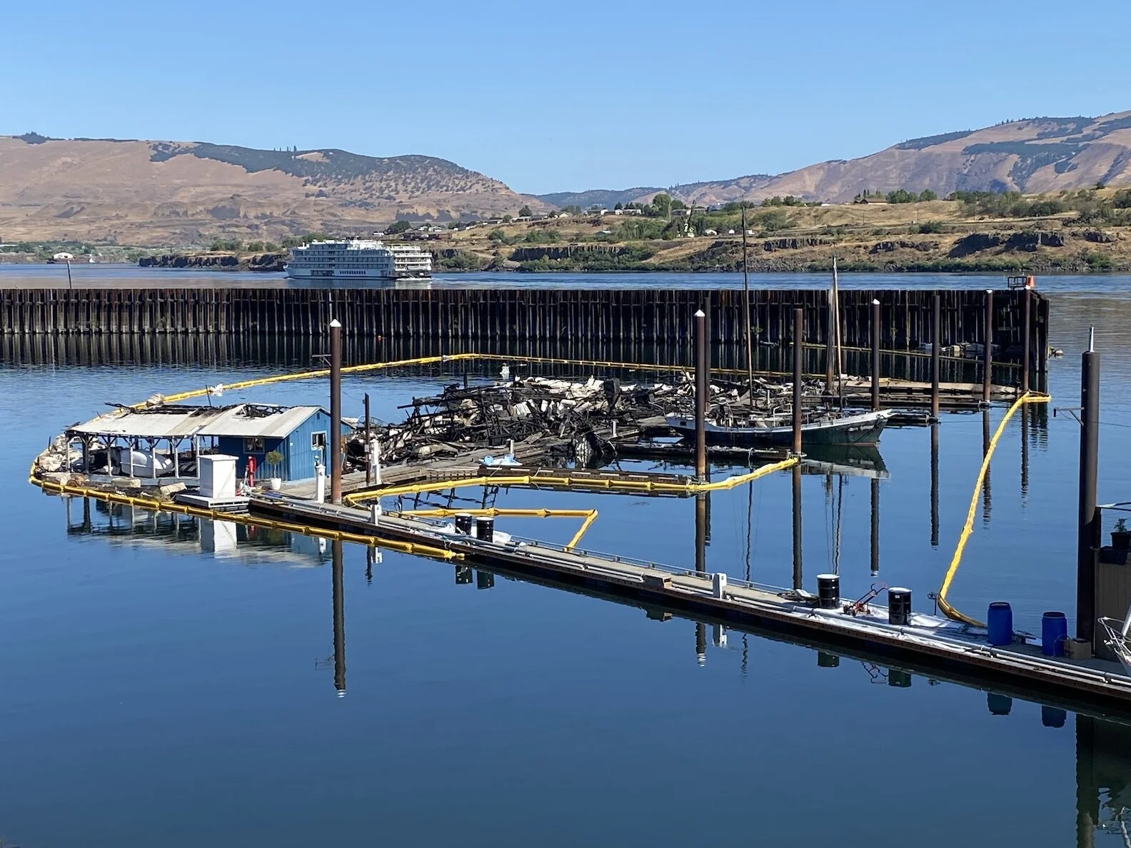 Finger D at the Port of The Dalles Marina this morning, July 9. Eight houseboats were destroyed and four other boats caught fire and sank here on July 4th.
