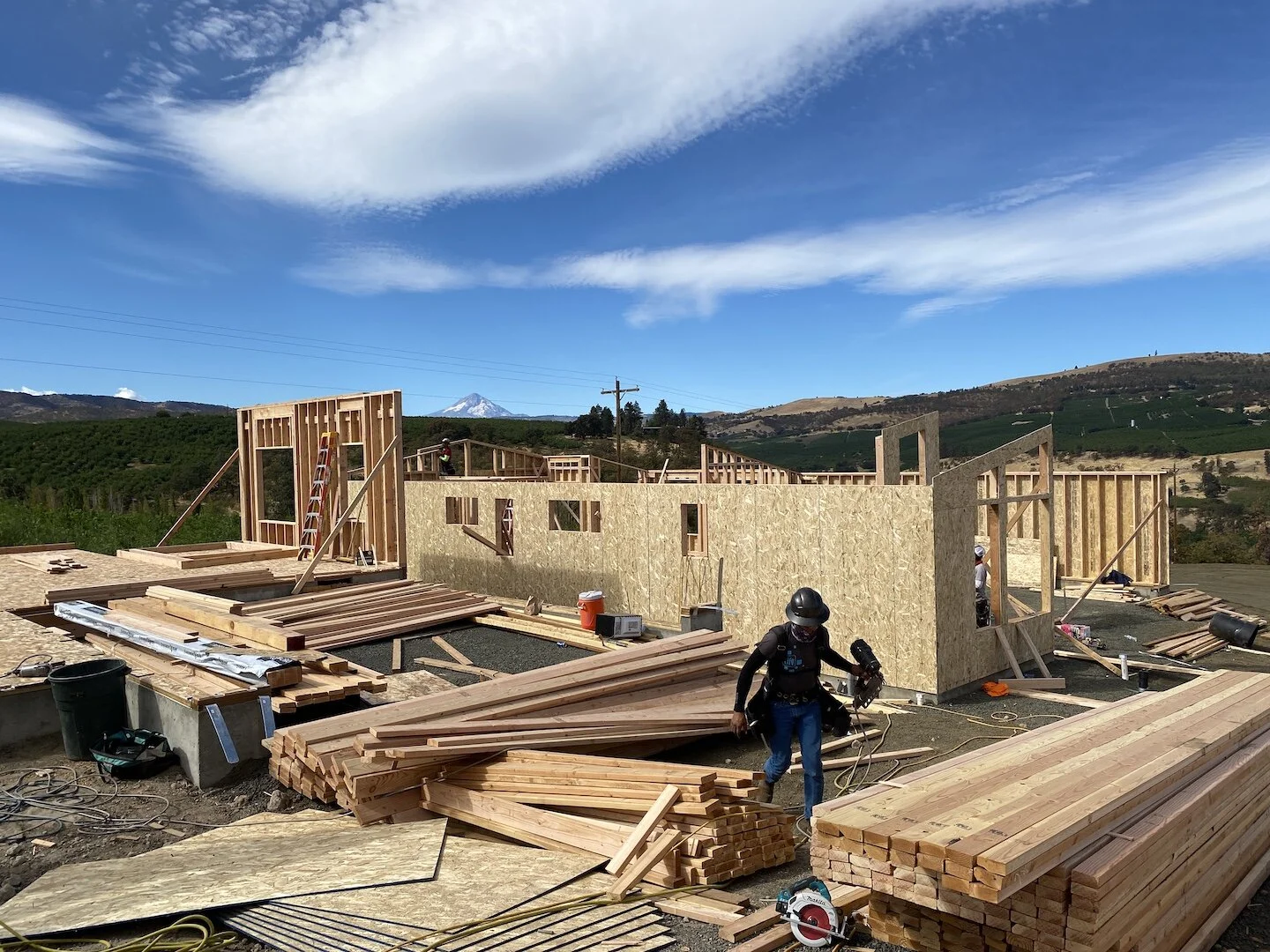 Construction workers at Park Place subdivision near Sorosis Park in The Dalles were hard at it on Wednesday, Sept. 15. High housing demand is keeping the construction trade on its heels.
