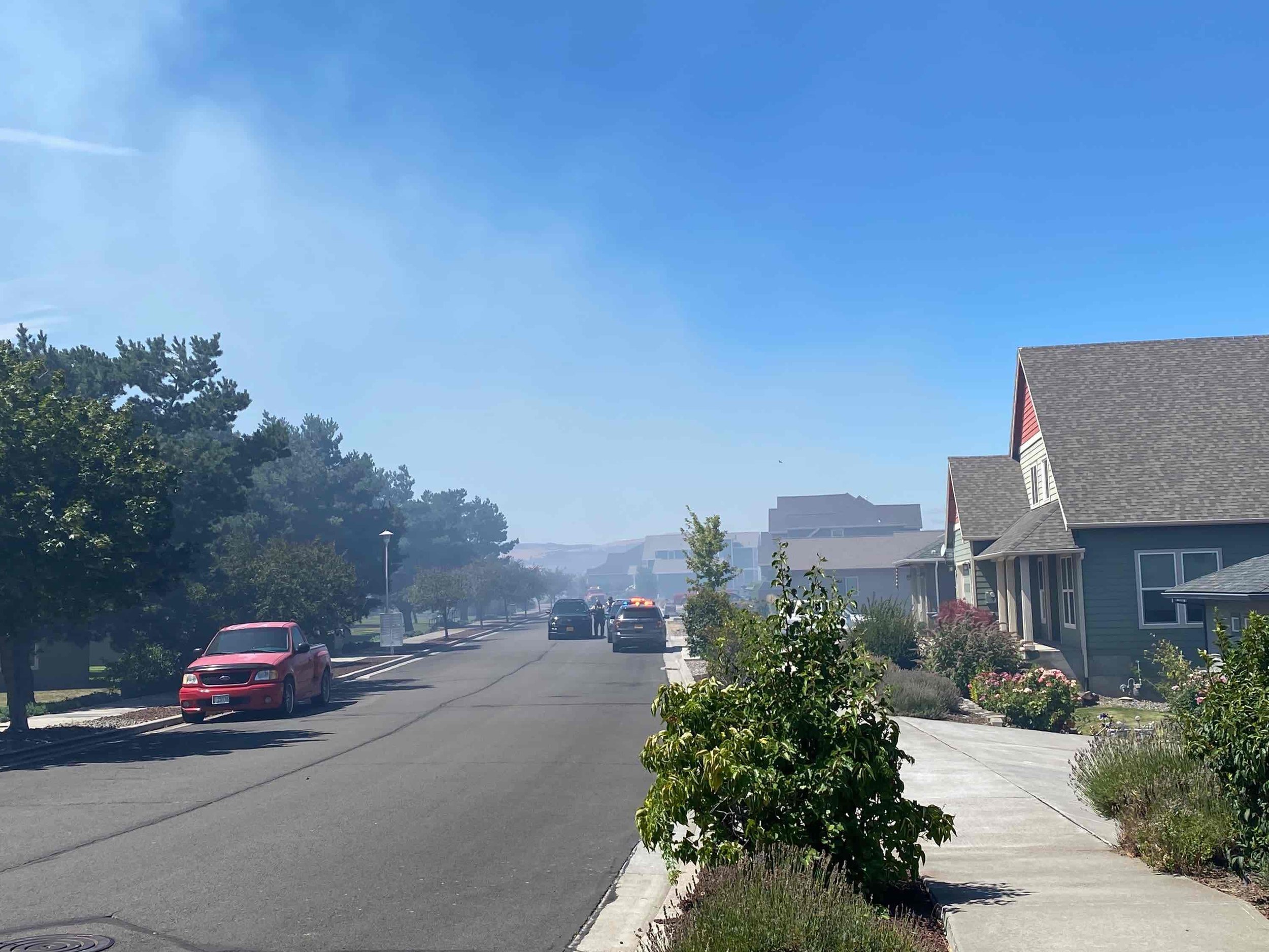 Smoke billows over homes on Columbia View Heights. Photo Credit: Tom Peterson