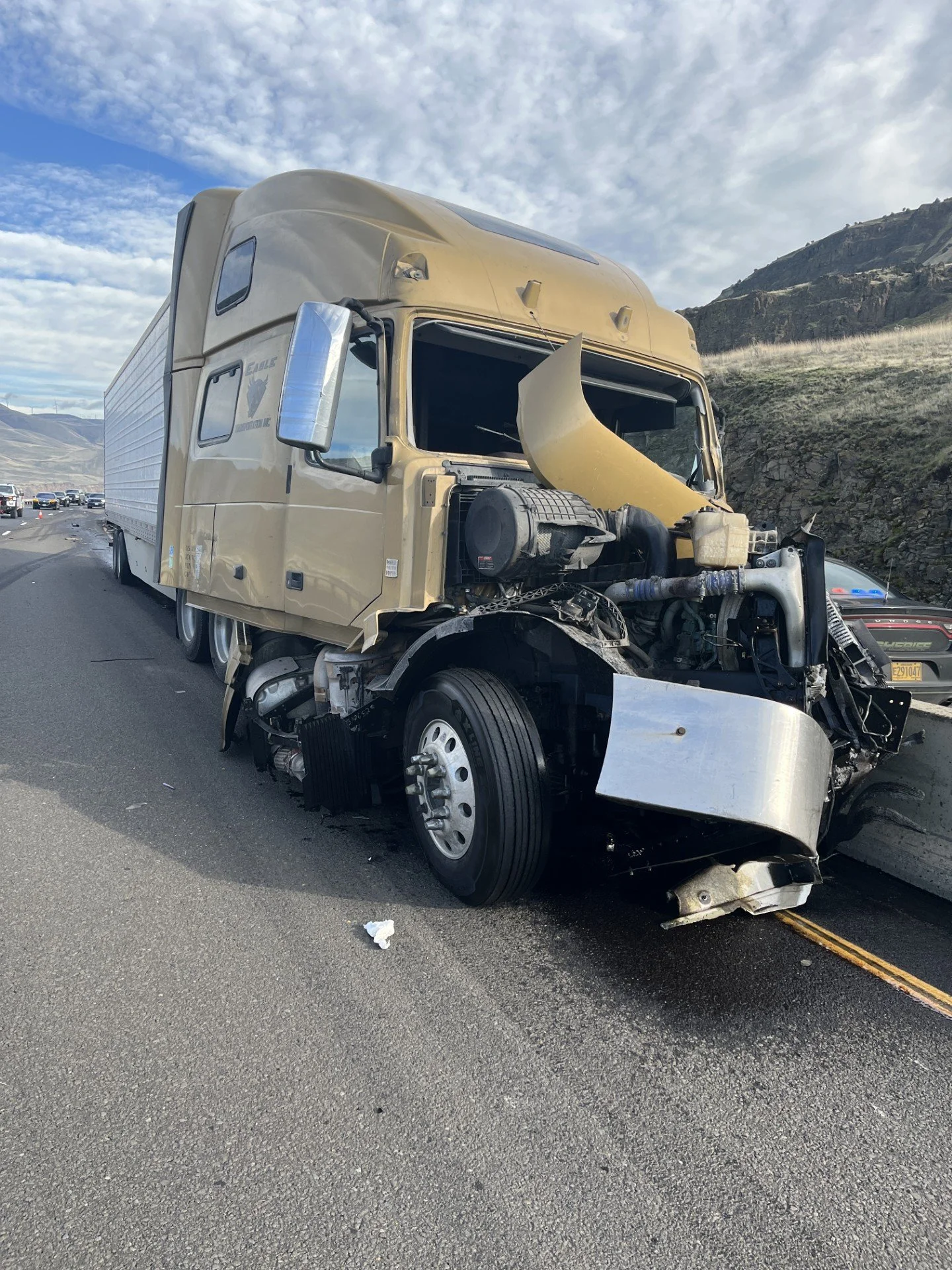 Two-semi crash involving hazardous materials snarls traffic on I-84