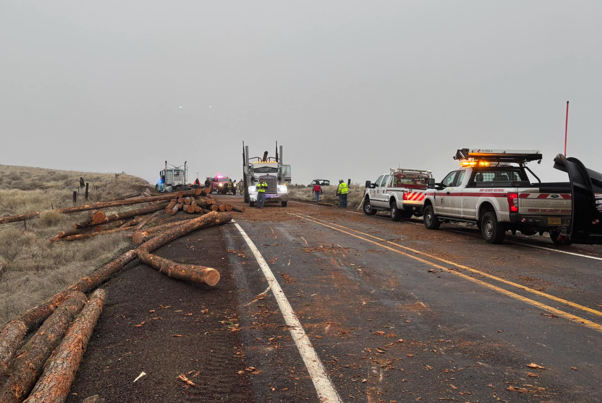 Log truck loses its load in Sherman County as icy road conditions continue