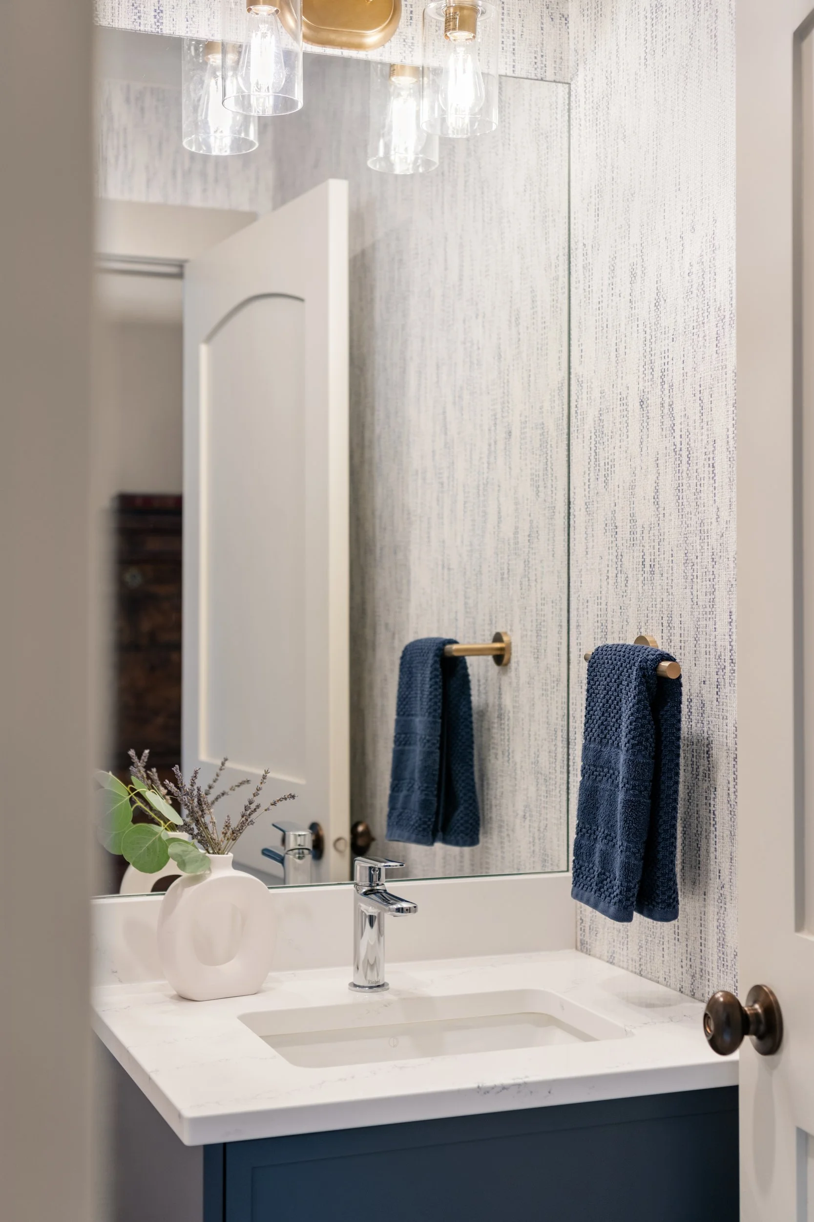 blue powder room grass cloth wall covering 