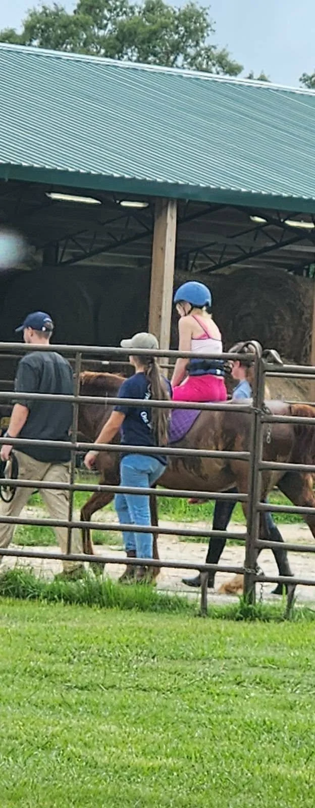 Destiny during horseback riding occupational therapy. She now receives OT and speech therapy at the clinic and will soon begin physical therapy there as well.