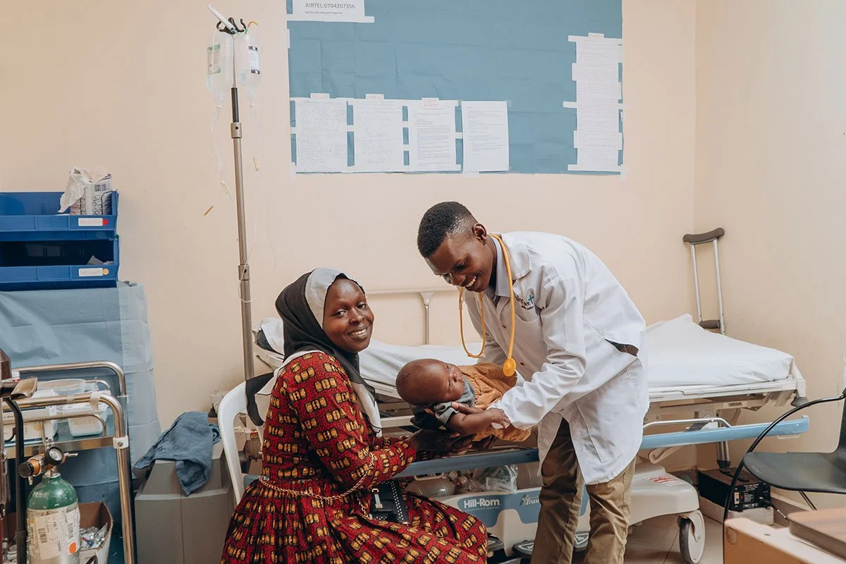 Patient receiving care at an AsOne Health Center in rural Uganda.