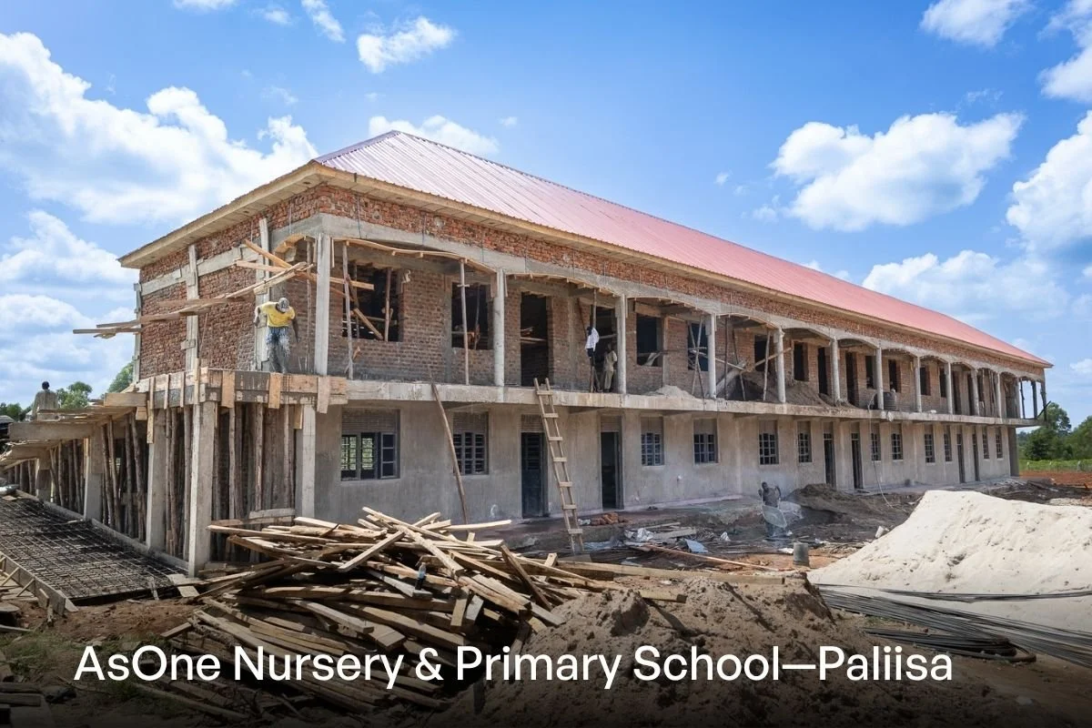 AsOne Nursery & Primary School, Pallisa under construction, with workers on scaffolding