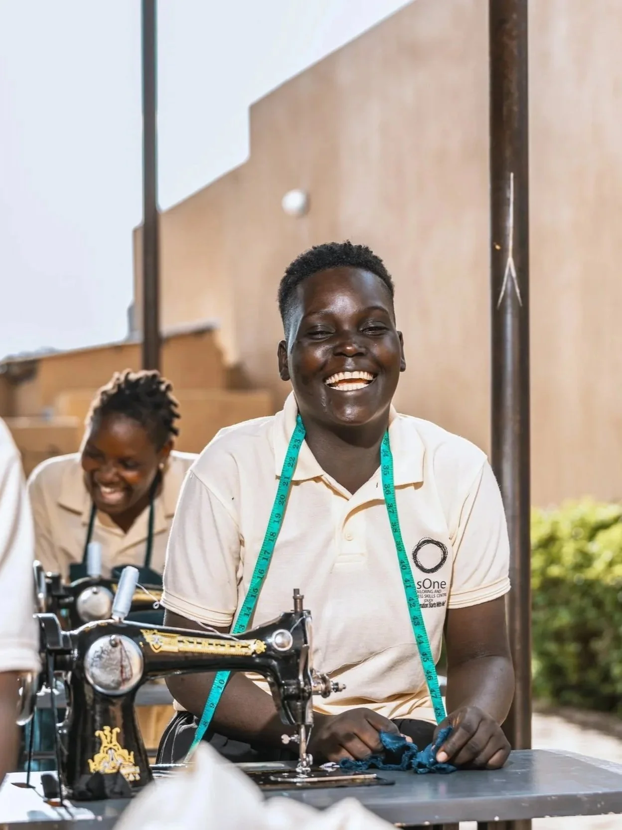 Tailoring students learning vocational skills at AsOne training center, Idudi.