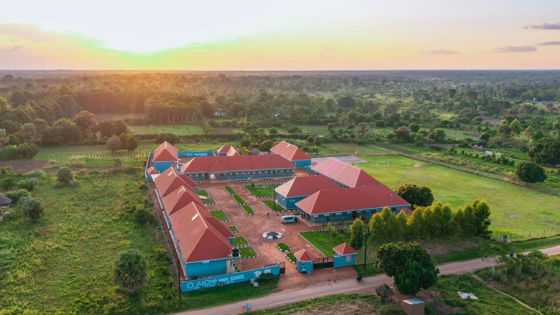 Aerial drone view of AsOne Nursery & Primary School, Pallisa, at sunset