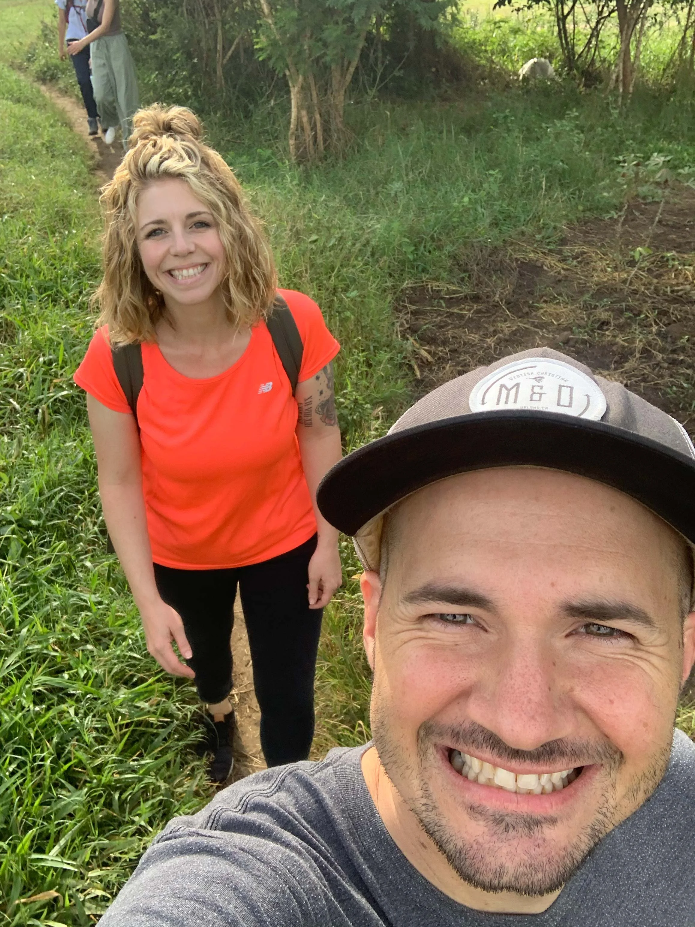 Chris and Lindsey, AsOne donors, taking a selfie together outdoors on a path
