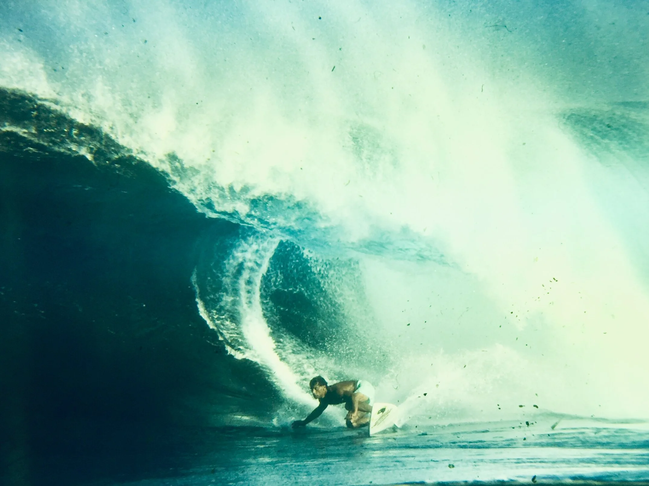 The great Hawaiian Dane Kealoha leaning low into a cavernous Backdoor section