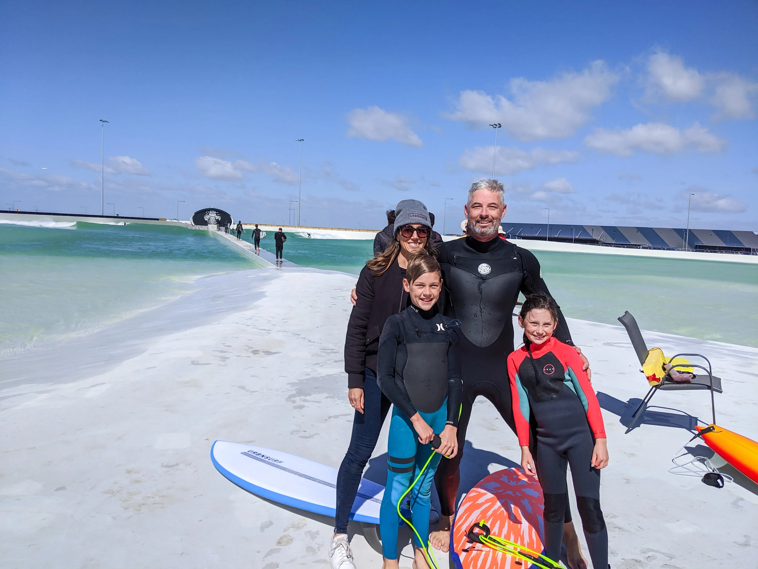 Andrew with wife Sam, son Lachie and daugther Chloe on the first day of surfing at UrbnSurf