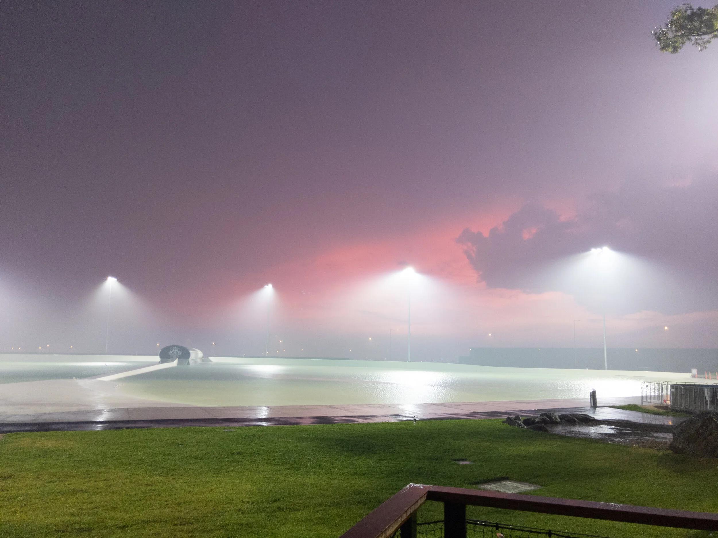 Tullamarine's UrbnSurf floodlit under a night sky just before opening